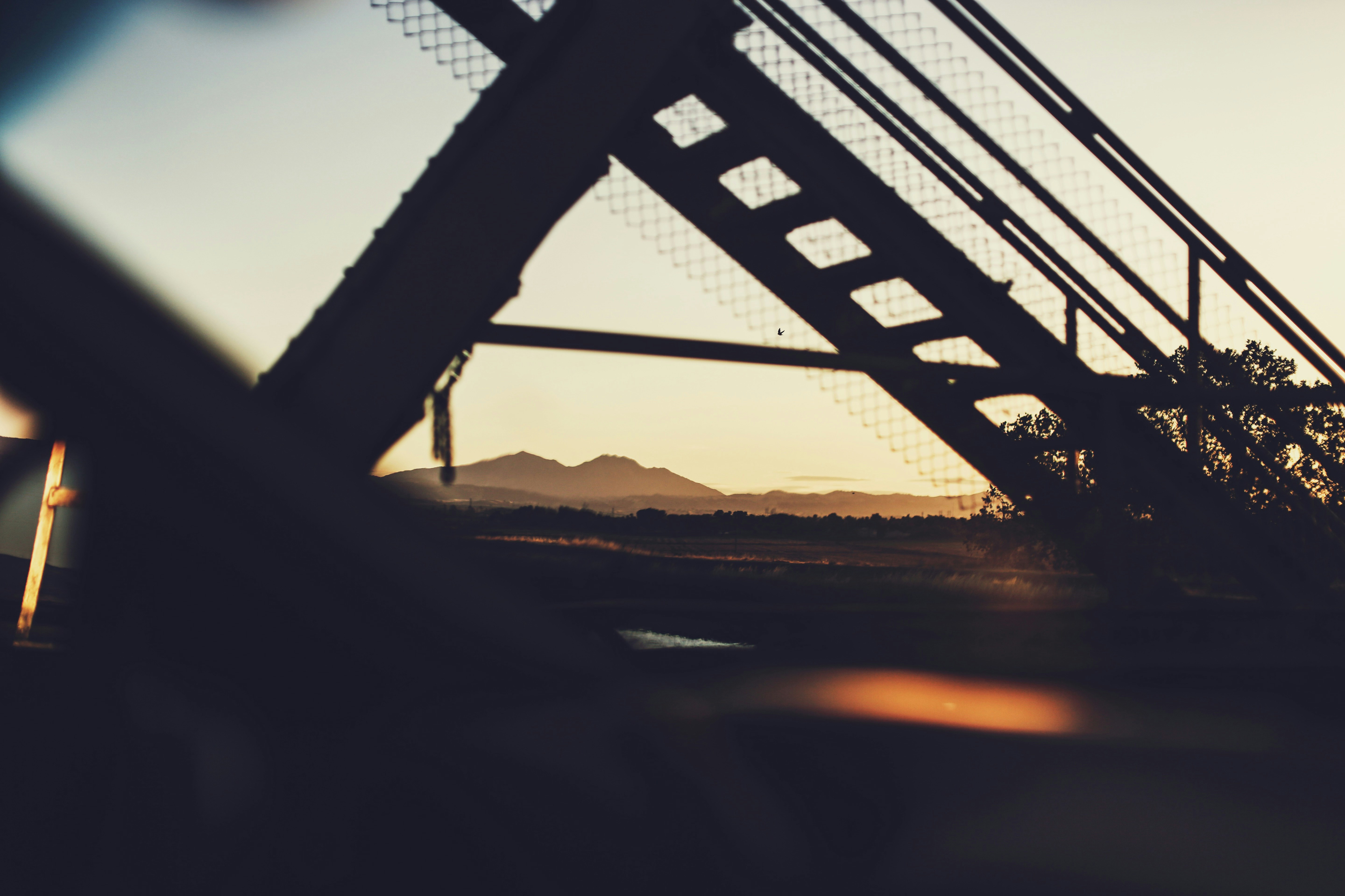 silhouette of bridge during sunset